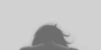 Photo of a sad, depressed, young person - possibly long COVID sufferer