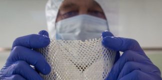 A technician looks at processed cod skin. Photo: Kerecis