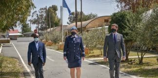 Three staff members walking in the street