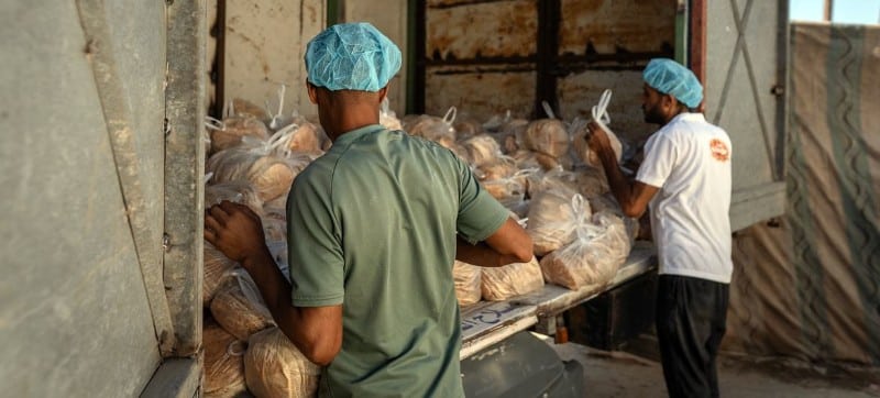 © WFP/Maxime Le Lijour | Bread is readied for distribution in Nuseirat, Gaza. Since the ceasefire took effect, flow of aid into the Strip has increased but needs remain immense.