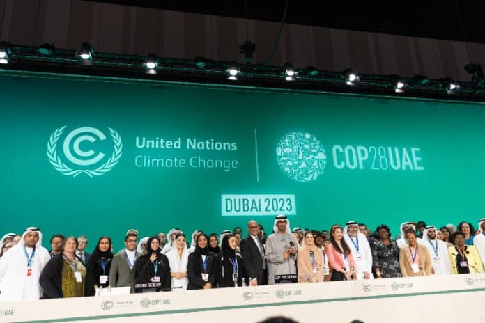 Dr. Sultan Al Jaber, COP28 President and other participants onstage during the Closing Plenary at the UN Climate Change Conference COP28 at Expo City Dubai on December 13, 2023, in Dubai, United Arab Emirates
