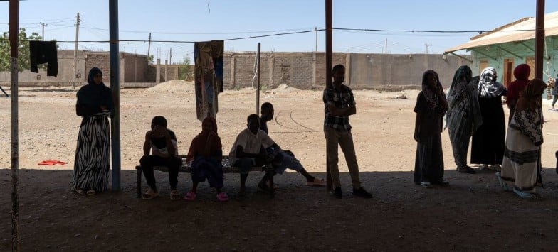 © UNOCHA/Giles Clarke People displaced by the conflict in Sudan rest at a facility in eastern Sudan after fleeing Khartoum.