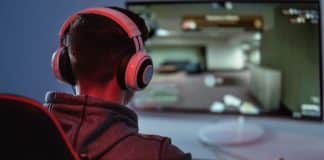 Video gamer playing with his headset on