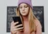 A girld holding a phone