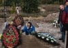 A mother in Bucha, Ukraine, buries her son
